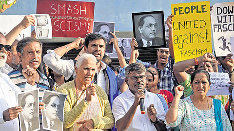 Members of Dalit Vidyarthi Parishat, Bangalore University Research Scholars’ Association, and other groups stage a protest against Union Home Minister Amit Shah’s remarks against Babasaheb Ambedkar at Freedom Park in Bengaluru.