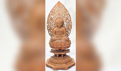 Buddha wood carving idol carved by  Pasari Shakuntala 