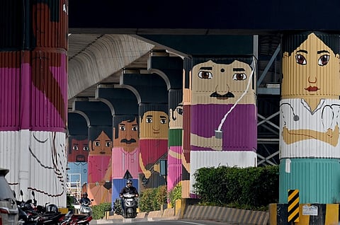 The mega paintings of Channapatna toys on the pillars of the yellow line of Namma Metro at Huskur painted by the Biocon Foundation. 