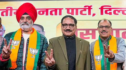 Delhi BJP chief Virendra Sachdeva (L) with ex-AAP leader Sukhveer Singh Dalal 