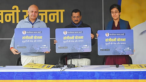 Delhi Chief Minister Atishi with AAP National Convener Arvind Kejriwal and party leader Manish Sisodia during a press conference regarding the launch of registrations for the party's 'Mahila Samman Yojana' and 'Sanjeevani Yojana', in New Delhi, Sunday, Dec. 22, 2024.