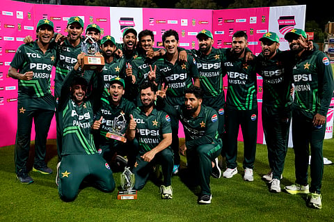 Pakistan's players pose with the trophy following the third International cricket match between South Africa and Pakistan, at the Wanderers stadium in Johannesburg, South Africa, Sunday, Dec. 22, 2024. 