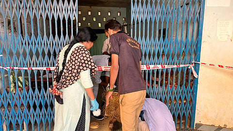 Police inspect the site on Monday. 