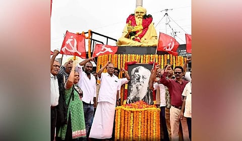 CPM party state secretary K Balakrishnan hoisting the flag at the Keezhvenmani memorial. 