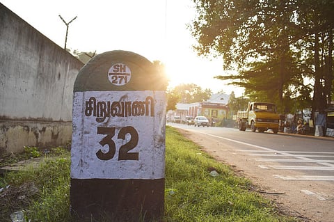 Vehicles plying on the Siruvani road at outskirts of  Coimbatore on Friday. . 