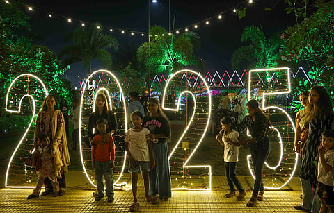 Visitors at the Bandra Reclamation, decked up on the eve of New Year celebrations, in Mumbai, Tuesday, Dec. 31, 2024.
