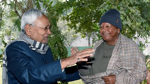 Bihar Chief Minister Nitish Kumar in conversation with RJD Chief Lalu Prasad Yadav at an event in Patna.