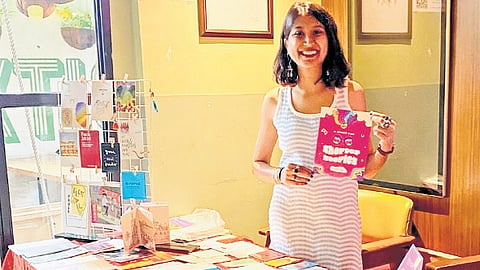 Ano Patel, founder and CEO of Bazinega, an online distribution platform for zines, running a pop-up stall