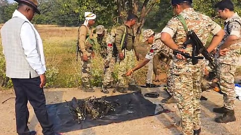 Security personnel near the site where Naxals blew up a District Reserve Guards (DRG) vehicle by an improvised explosive device (IED) that killed at least eight jawans and a civilian were killed, in Chhattisgarh's Bijapur district.