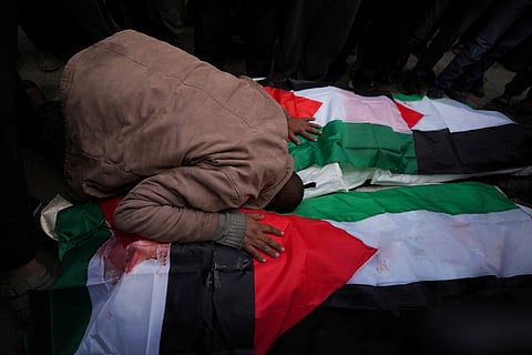 Palestinians mourn their relatives killed by Israel at Al-Aqsa Martyrs Hospital in Deir al-Balah, Sunday, Jan. 5, 2025.