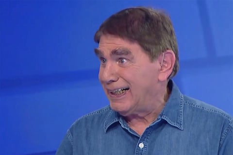 In this frame grab taken from video provided by CHANNEL 12 NEWS, Israeli journalist Moshe Nussbaum whose speech is impaired due to ALS (amyotrophic lateral sclerosis), talks in a studio, Neve Ilan, Israel, on Dec. 28, 2024. 