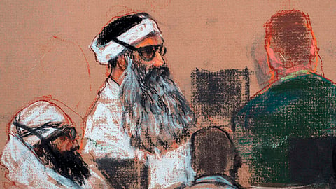 Drawing by artist Janet Hamlin and reviewed by the U.S. military, shows Khalid Sheikh Mohammed, center, and co-defendant Walid Bin Attash, left, attending a pre-trial session at Guantanamo Bay Naval Base, Cuba. 