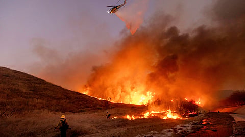 Fire crews battle the Kenneth Fire in the West Hills section of Los Angeles, Thursday, Jan. 9, 2025. 