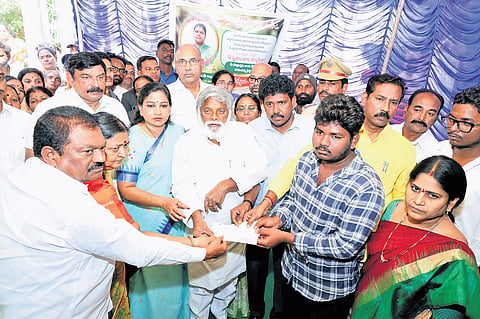 Home Minister Vangalapudi Anitha hands over ex gratia to the families of Tirupati stampede victims in Visakhapatnam on Sunday