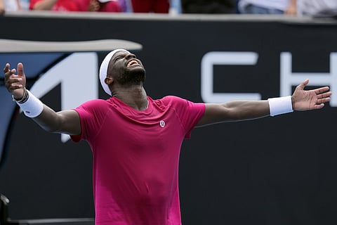 Frances Tiafoe of the US celebrates after defeating Arthur Rinderknech  of France in the first round match at the Australian Open tennis championship at Melbourne, Australia, Monday, Jan 13, 2025