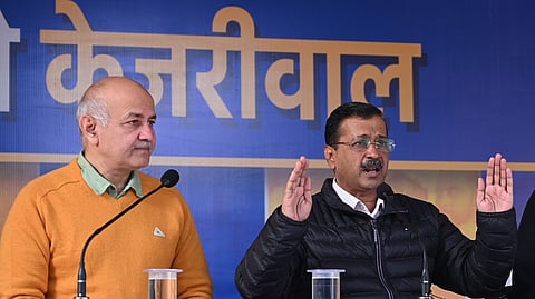 Aam Aadmi Party  chief Arvind Kejriwal and party leader Manish Sisodia, left address a press conference, in New Delhi. 