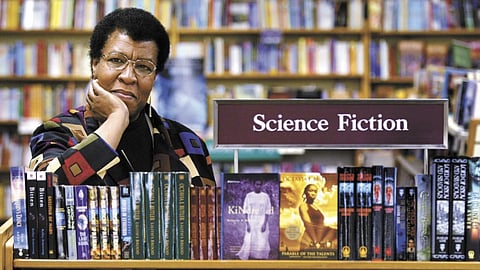 Octavia Butler poses for a photograph near some of her novels at University Book Store in Seattle, Washington, on Feb. 4, 2004. 