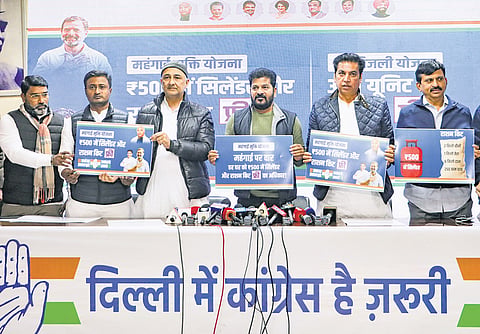 Chief Minister A Revanth Reddy, along with AICC Delhi in-charge Qazi Nizamuddin, Delhi Congress President Devender Yadav and other leaders, unveils the Congress’ promises during a press conference in New Delhi 
