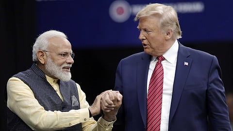 In this photo from Sept. 22, 2019, Prime Minister Narendra Modi and President Donald Trump shake hands after introductions during the "Howdi Modi" event in Houston.