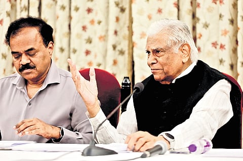 Principal Secretary to Governor M Dana Kishore announces list of awardees while former Union Home Secretary K Padmanabhaiah looks on 