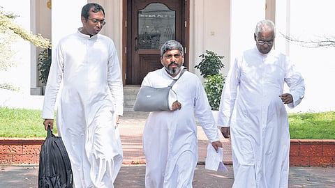 Priests leaving after a discussion with Archbishop Mar Joseph Pamplany at the 
Bishop House in Kochi