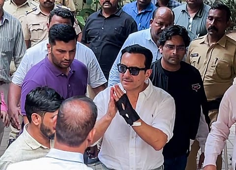 Actor Saif Ali Khan greets as he arrives at his residence after getting discharged from Lilavati Hospital, in Mumbai on Tuesday. 