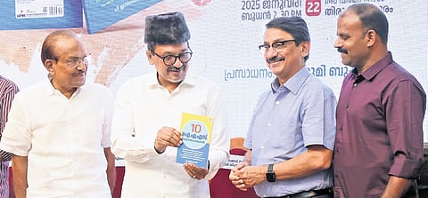 IUML state president Panakkad Sayyid Sadiq Ali Shihab Thangal launching ‘10 IAS Vijayagaathakal’ written by P Ismayil on Wednesday. Party leader P K Kunhalikutty and former chief secretary V Venu are also seen.  