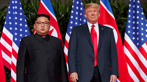 US President Donald Trump, right, meets with North Korean leader Kim Jong Un on Sentosa Island, in Singapore, June 12, 2018.