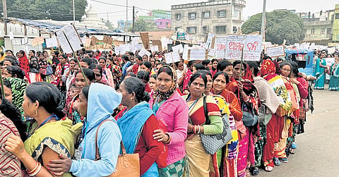 Agitating Mission Shakti workers taking out the protest rally at Baripada 