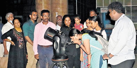 Crowds lining up to catch a glimpse of a rare parade in which six planets, from Venus to Neptune, aligned closely in the night sky 
