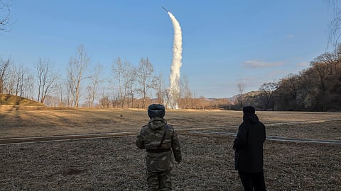 In this photo provided by the North Korean government, its leader Kim Jong Un, right, inspects testing of sea-to-surface strategic cruise-guided weapons at an undisclosed location in North Korea, Saturday, Jan. 25, 2025.
