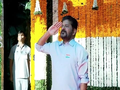Telangana CM Revanth Reddy unfurls the national flag at his residence on 76th Republic Day. 