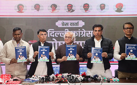 Congress leaders Jairam Ramesh, center, Pawan Khera, second left, and Udit Raj, left, with Delhi Congress President Devender Yadav, second right, and others during the release of the partys manifesto for the upcoming Delhi Assembly elections, in New Delhi, Wednesday, Jan. 29, 2025.