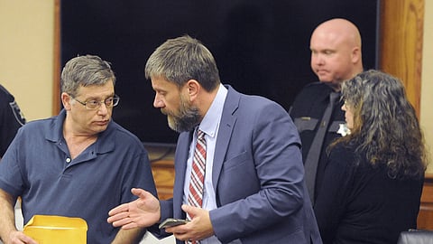 Donald Lantz, left, speaks with his attorney John Balenovich as his wife  Jeanne Kay Whitefeather, right, leaves the courtroom in Kanawha County Circuit Court in Charleston, W.Va. on Wednesday, Jan 29, 2025.