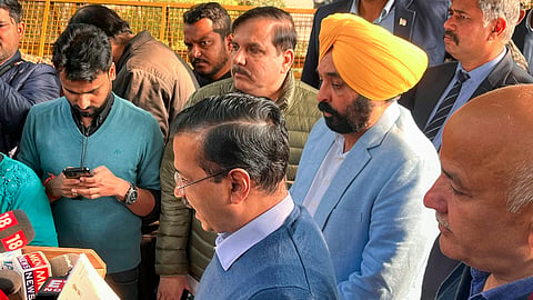  Former Delhi CM and AAP national convener Arvind Kejriwal with Punjab CM Bhagwant Mann and AAP MP Sanjay Singh addresses the media before leaving from his residence to meet Election Commissioners, in New Delhi
