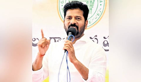 Chief Minister A Revanth Reddy speaks after laying foundation for a school building and other development works in Mogiligidda village.