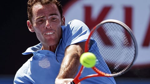 France’s David Guez hits a shot to compatriot Richard Gasquet during their first round match at the Australian Open tennis tournament in Melbourne, Australia, Monday, Jan. 13, 2014. 