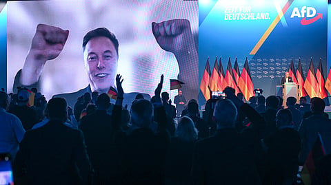 US businessman Elon Musk is shown during a live video link, as Alice Weidel, AfD candidate for chancellor takes to the stage, during the AfD's election campaign kick-off, in Halle, Germany, Saturday, Jan. 25, 2025. 