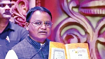CM Mohan Charan Majhi with the reprinted edition of Barnabodha 