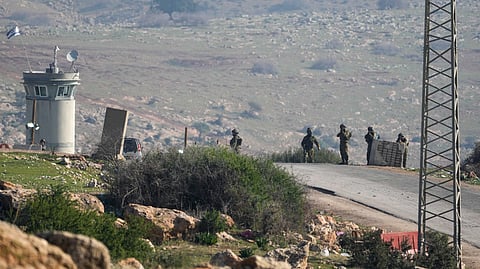 Israeli soldiers stand guard at a checkpoint where the military said an attacker fired at an army base near the village of Tayasir in the northern West Bank, Tuesday, Feb. 4, 2025. 
