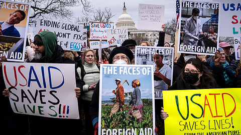 Demonstrators and lawmakers rally against President Donald Trump and his ally Elon Musk as they disrupt the federal government, including dismantling the U.S. Agency for International Development in Washington.