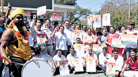Congress workers celebrate in Mysuru on Friday 