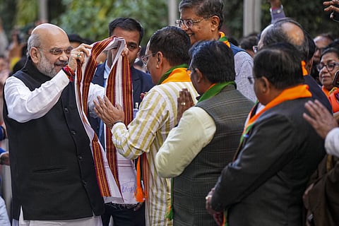 Union Home Minister Amit Shah arrives at the party headquarters, amid the counting of votes for Delhi Assembly elections, in New Delhi, Saturday, Feb. 8, 2025. 