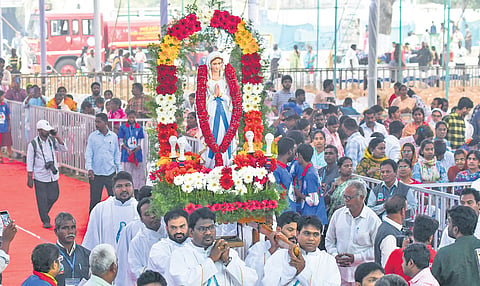 Bishop Thelagathoti Joseph Raja Rao and other clergy members of Gunadala shrine carrying Mother Mary’s idol into the prayer arena in Vijayawada 