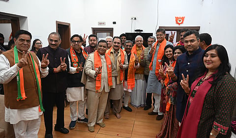 BJP president Virendra Sachdeva along with newly BJP MLAs during a meeting at BJP Delhi office, Pt Marg in New Delhi on Sunday.