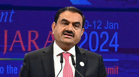 In this photo from Jan. 10, 2024, billionaire Gautam Adani addresses a gathering during the inaugural session of Vibrant Gujarat Global Summit 2024 in Gandhinagar.
