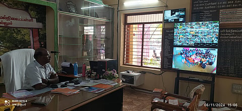 Headmaster K Muthuselvan monitoring different parts of the campus from his
office  in Government Model Girls Higher Secondary School at Manachanallur.