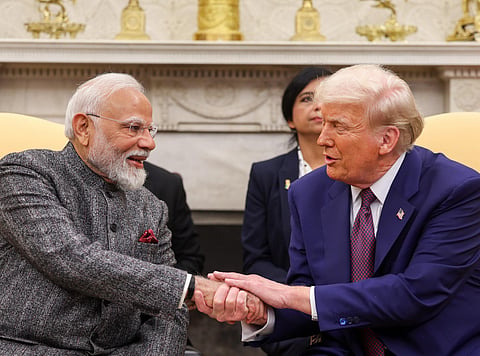 In this handout image provided on Friday, Feb. 14, 2025, Prime Minister Narendra Modi with US President Donald Trump during a meeting at the White House, in Washington, DC.