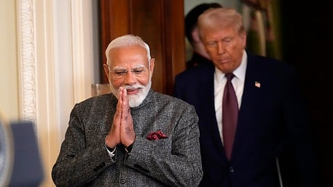 Prime Minister Narendra Modi, left, and US President Donald Trump arrive for a news conference in the East Room of the White House, Thursday, Feb. 13, 2025, in Washington.
