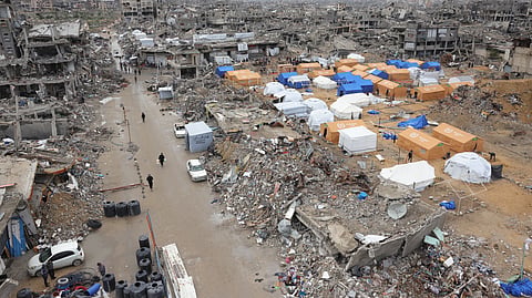 Palestinians take shelter in tents set up amid heavily damaged buildings in Jabalia in the northern Gaza Strip  during a truce in the war between Israel and Hamas. 
